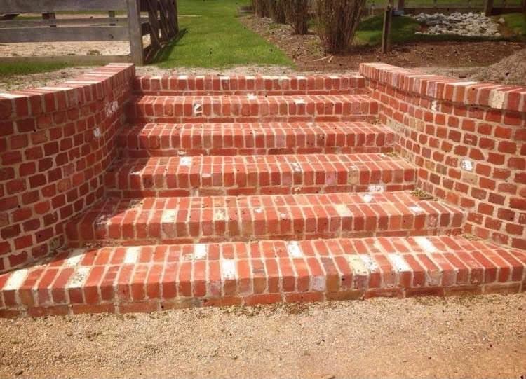 Old red-brick steps with side parapet walls, restoration