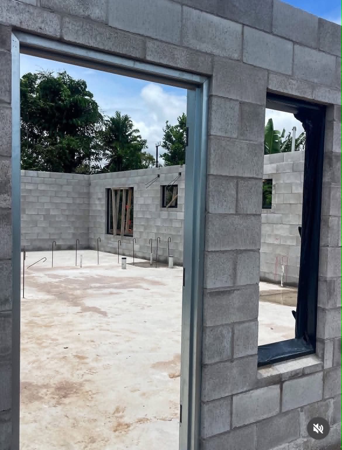 Block-built tropical home in progress, framed door opening