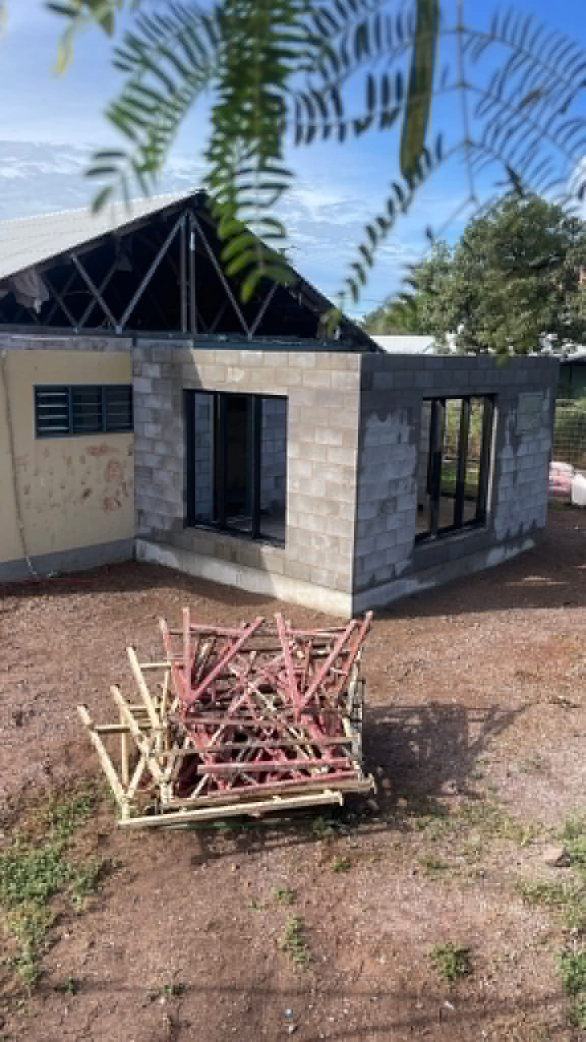 Block-built tropical home extension with framed roof