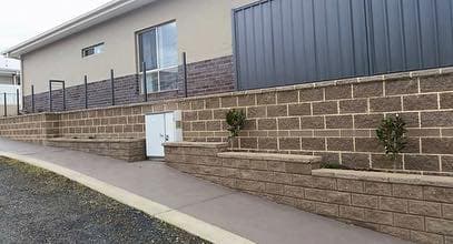 Modern stone retaining. Split-face block · pickets