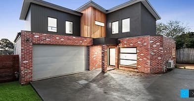 Finished two-storey contemporary home, brick lower and dark timber upper