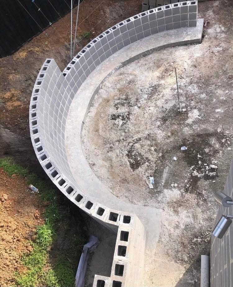 Aerial of a half-finished circular cyclone-rated block wall